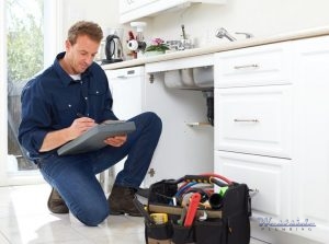 A Plumber Performs an Inspection